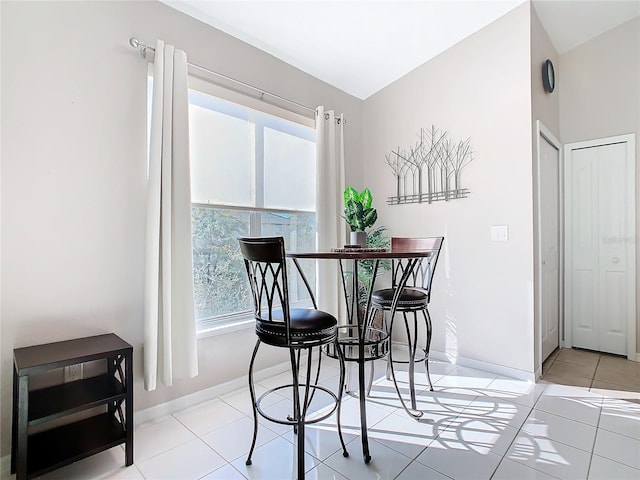 dining area featuring light tile patterned floors