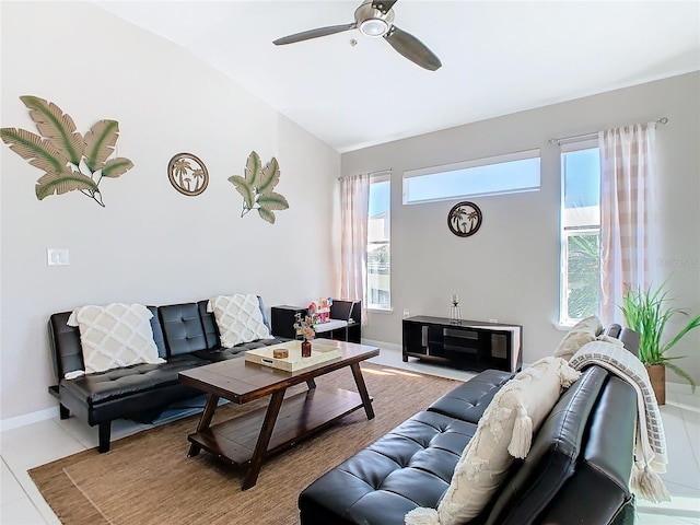 living room featuring ceiling fan, light tile patterned flooring, and lofted ceiling