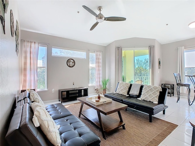 tiled living room with ceiling fan and plenty of natural light