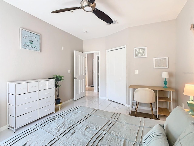 tiled bedroom featuring a closet and ceiling fan