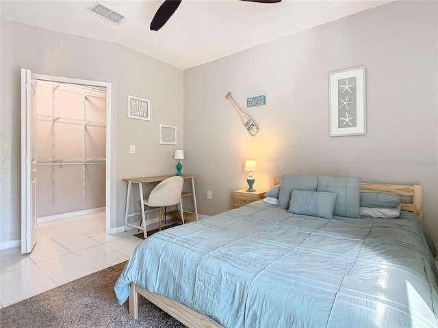 tiled bedroom with ceiling fan