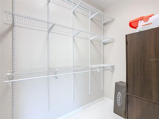 walk in closet featuring light tile patterned floors