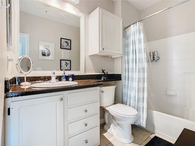 full bathroom featuring toilet, shower / bath combo, vanity, and tile patterned floors