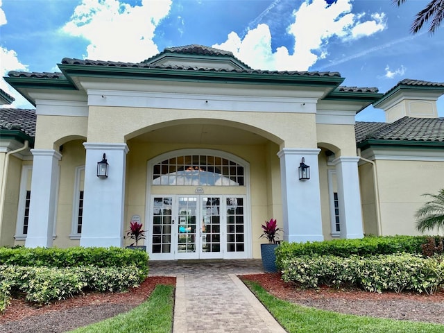 view of exterior entry featuring french doors