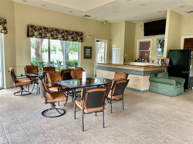 dining room featuring light tile patterned floors