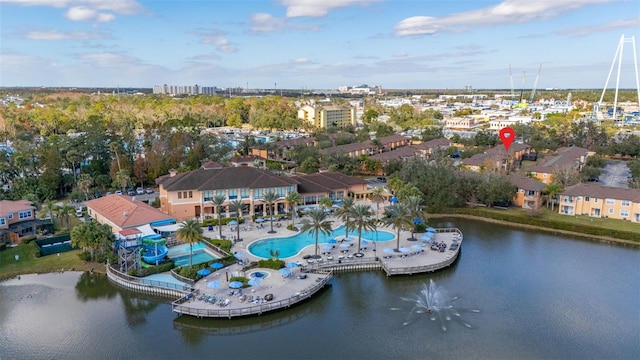 birds eye view of property with a water view