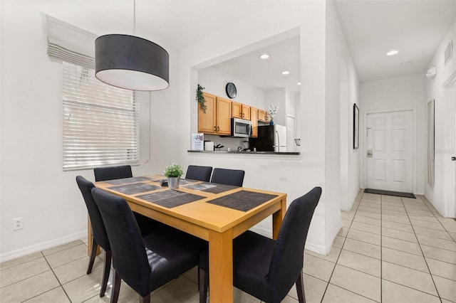 dining room featuring light tile patterned floors