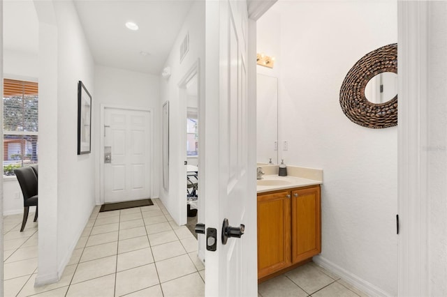 bathroom with tile patterned flooring and vanity