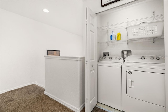 laundry area with washing machine and clothes dryer and carpet floors