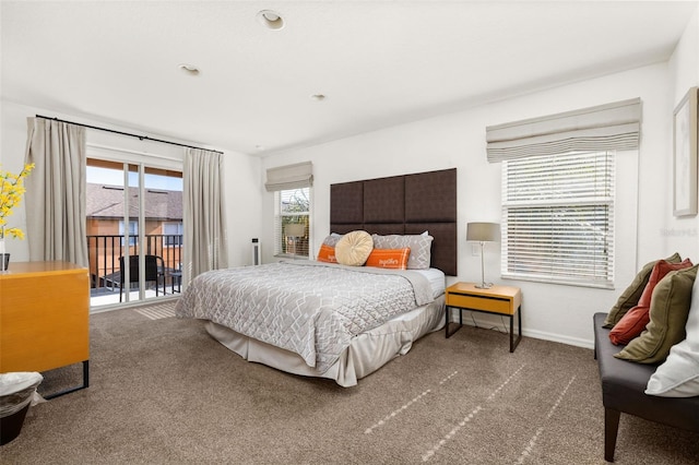 bedroom with access to outside and carpet floors