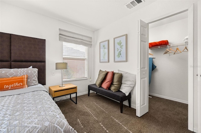 carpeted bedroom with a closet