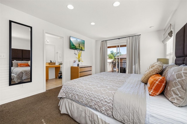 carpeted bedroom featuring ensuite bathroom and access to outside