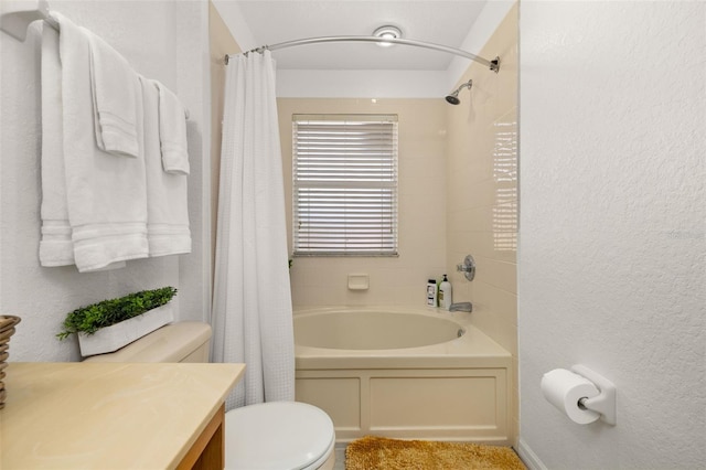 full bathroom with toilet, vanity, and shower / tub combo with curtain