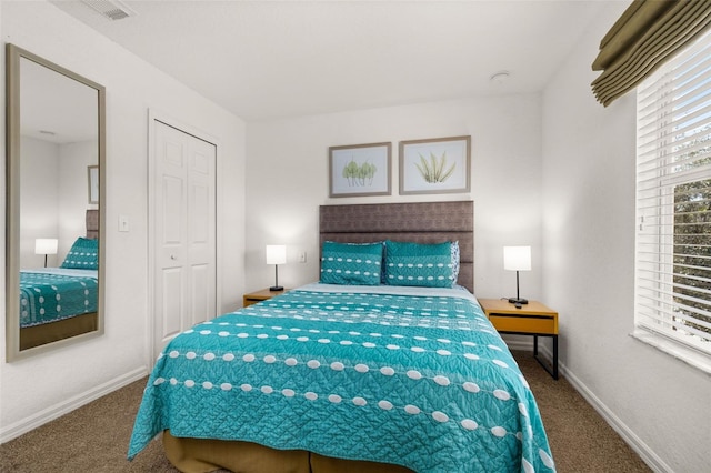 bedroom with carpet and a closet