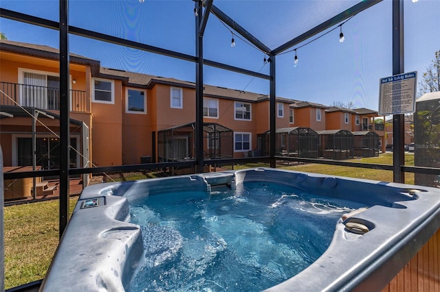 view of pool with a hot tub