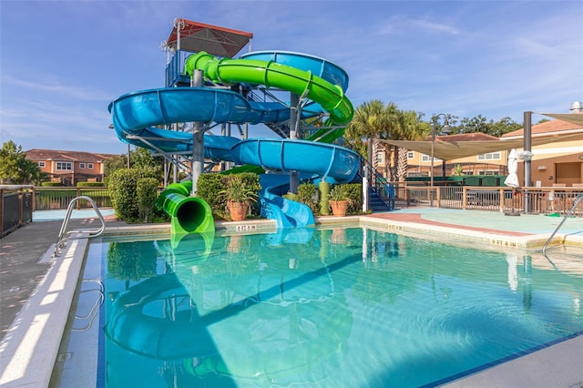 view of swimming pool featuring a water slide