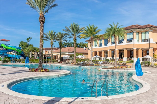 view of pool with a water slide