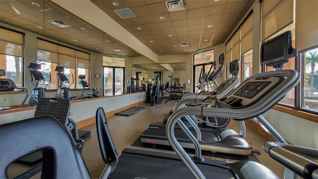 gym featuring a paneled ceiling