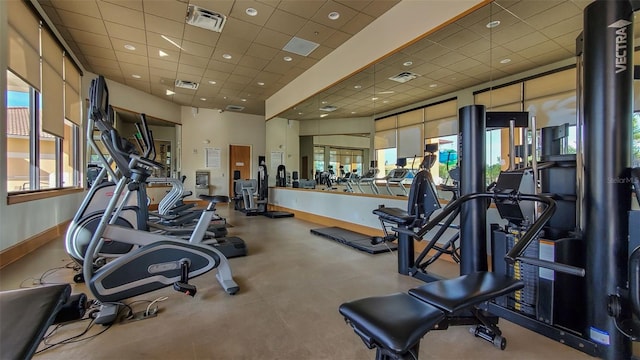 exercise room with a paneled ceiling