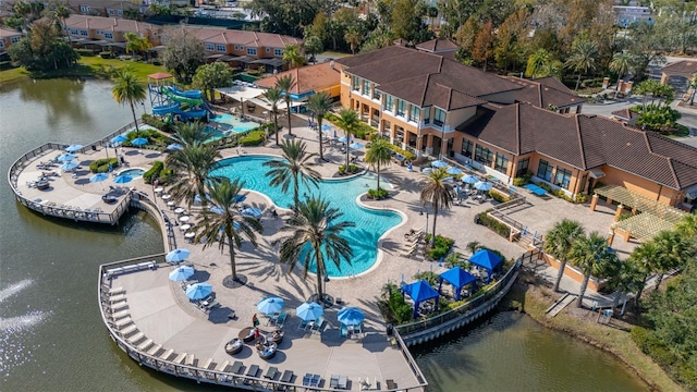 birds eye view of property with a water view