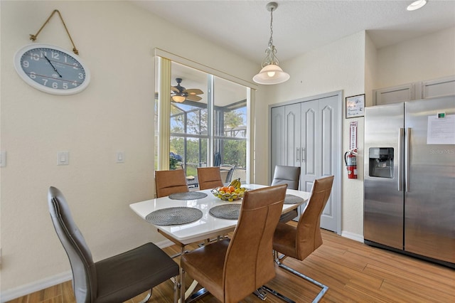 dining area featuring ceiling fan and light hardwood / wood-style flooring