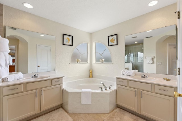 bathroom featuring vanity, tile patterned floors, and independent shower and bath