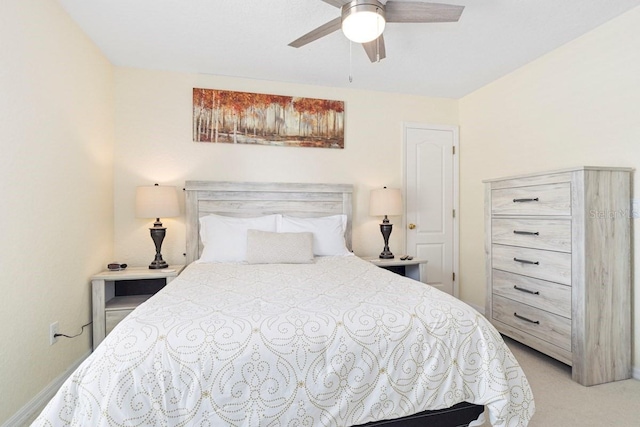 bedroom featuring ceiling fan and light carpet