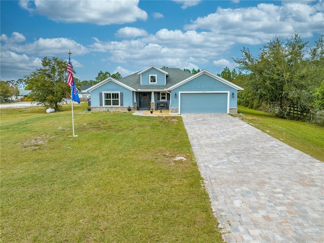 view of front of house with a porch, a garage, and a front yard