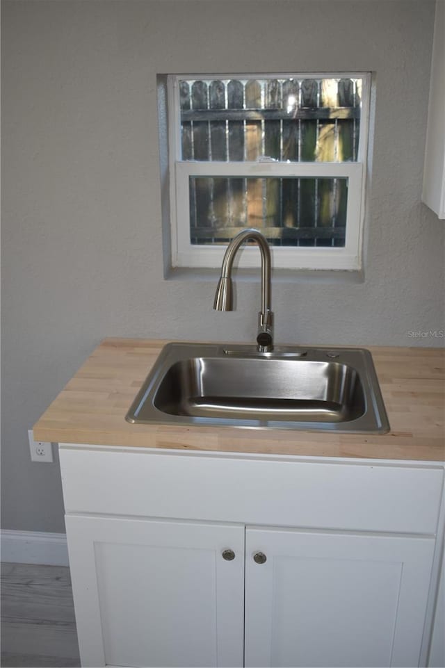 room details with sink and white cabinets