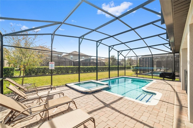 view of swimming pool featuring an in ground hot tub, a patio, glass enclosure, and a lawn