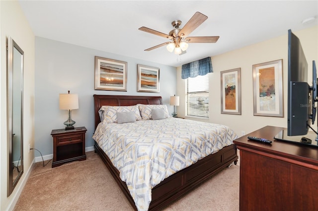 bedroom featuring ceiling fan and light colored carpet