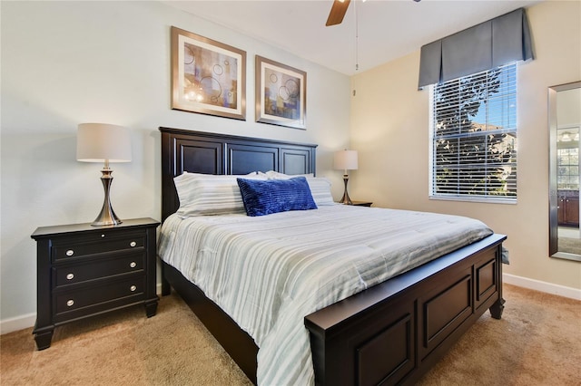 bedroom with light carpet and ceiling fan