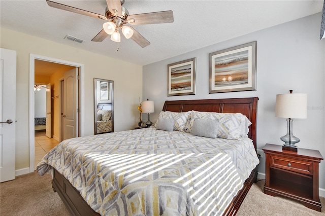 bedroom with ceiling fan and light colored carpet