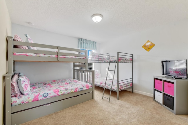 carpeted bedroom with a textured ceiling