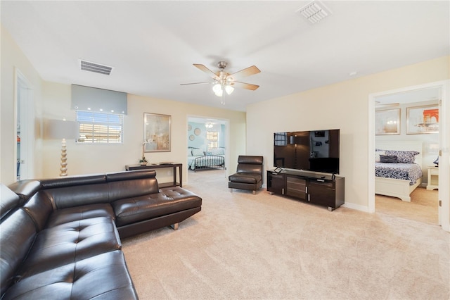 1455 Rolling Fairway Dr, Davenport, FL 33896 - living room featuring light carpet, ceiling fan, and plenty of natural light