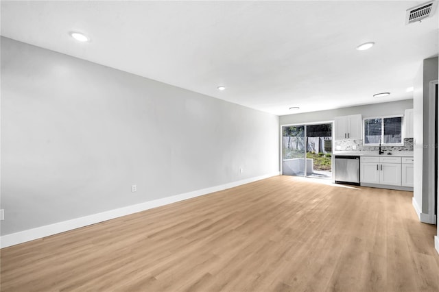 unfurnished living room with light wood-type flooring