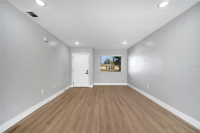 unfurnished room with light hardwood / wood-style flooring