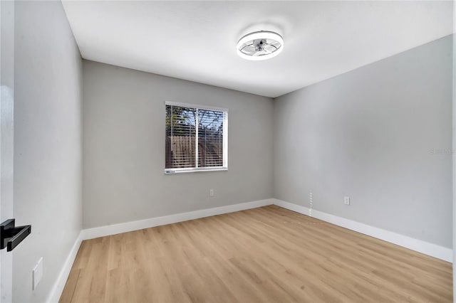 spare room with light hardwood / wood-style floors