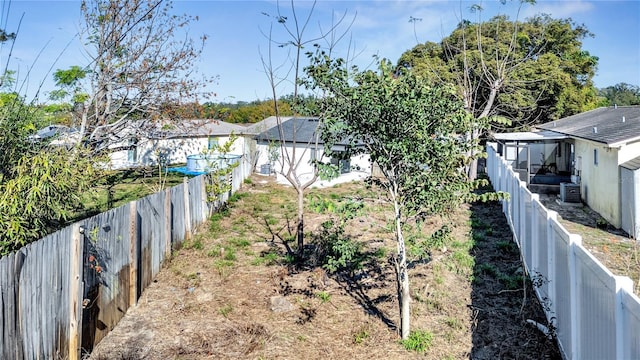 view of yard with central air condition unit