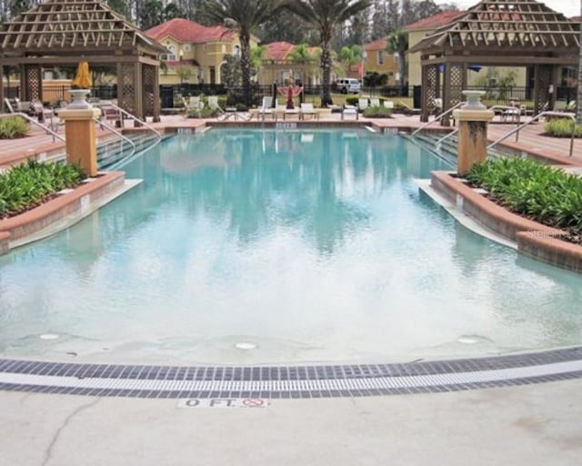 view of swimming pool featuring a gazebo