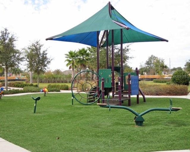 view of playground featuring a yard