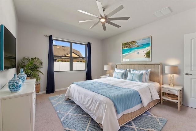 bedroom featuring ceiling fan and light carpet