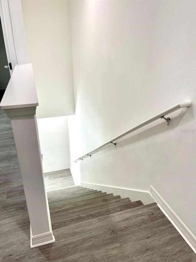 staircase featuring hardwood / wood-style flooring