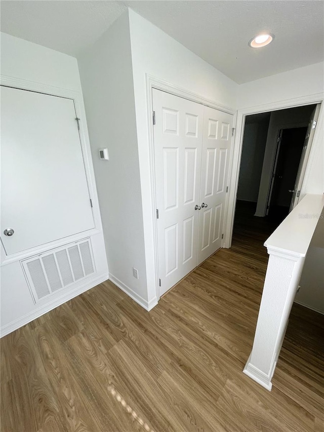 hall featuring wood-type flooring