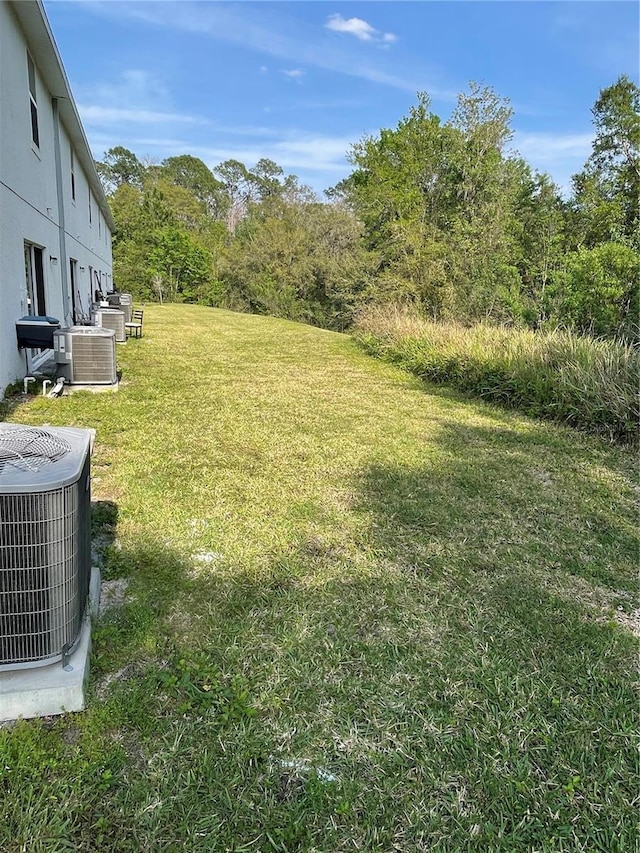 view of yard featuring central AC