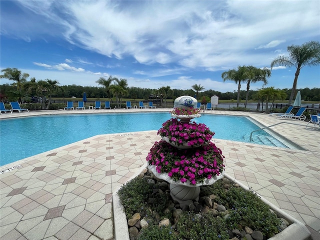 view of swimming pool featuring a patio