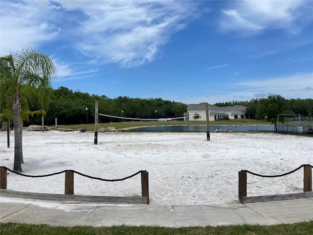 view of property's community featuring a water view and volleyball court