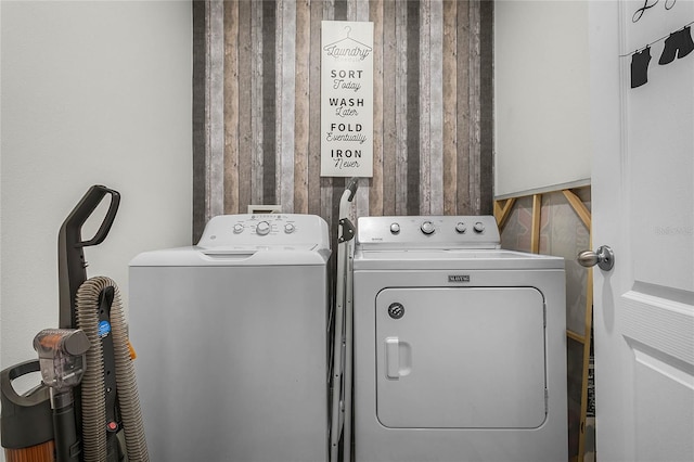 laundry area featuring washing machine and clothes dryer