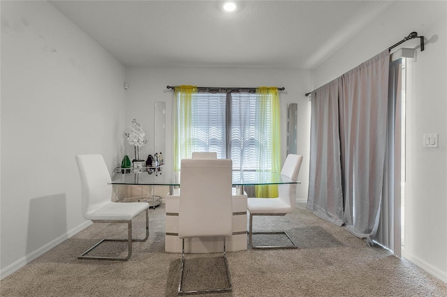 dining space featuring carpet flooring