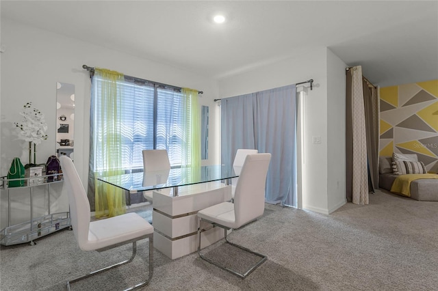 view of carpeted dining area